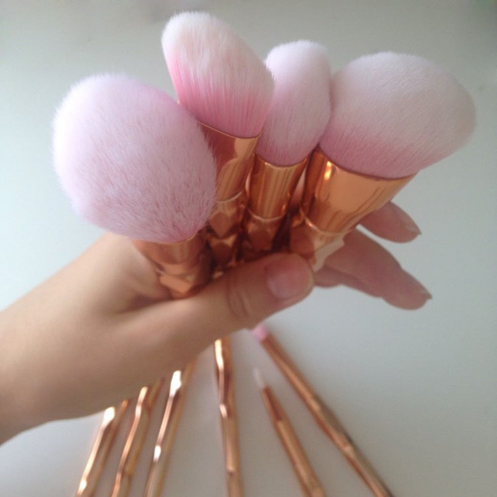 Soft synthetic bristles on rose gold makeup brushes”